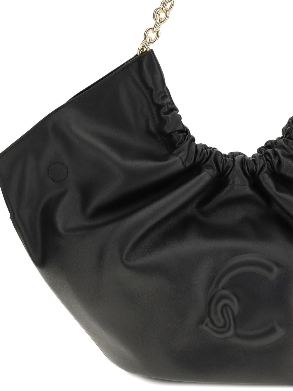 COCCINELLE Borsa a spalla nera in tessuto morbito satinato lucido 