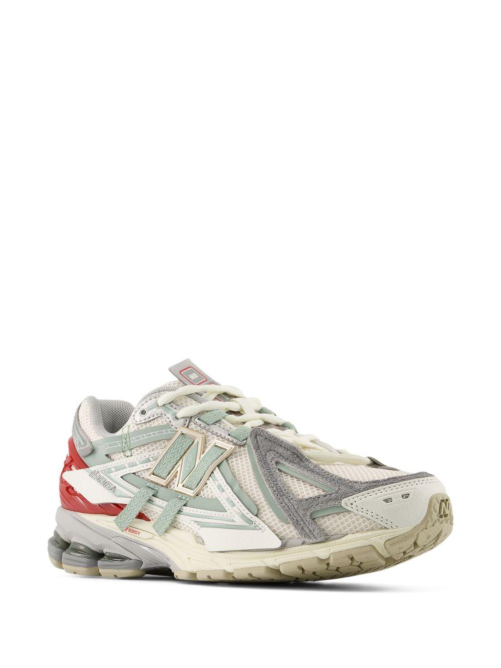 NEW BALANCE Sneakers 1906 bianche grigie e rosse 