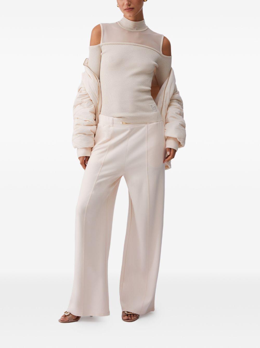 LIUJO Pantaloni cremai in jersey con dettaglio catena 