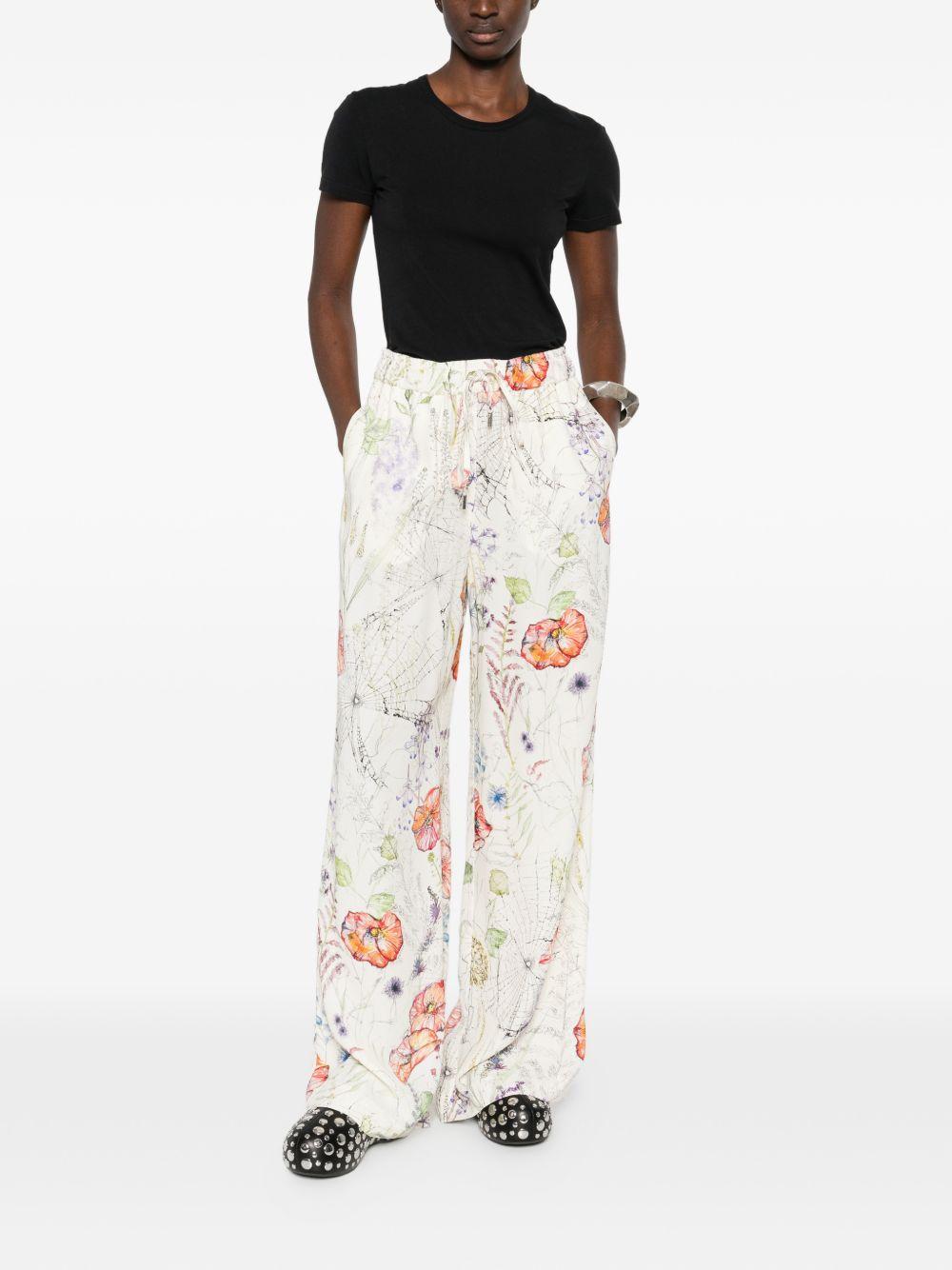 ALEXANDER McQUEEN Pantaloni in cotone con fantasia floreale 