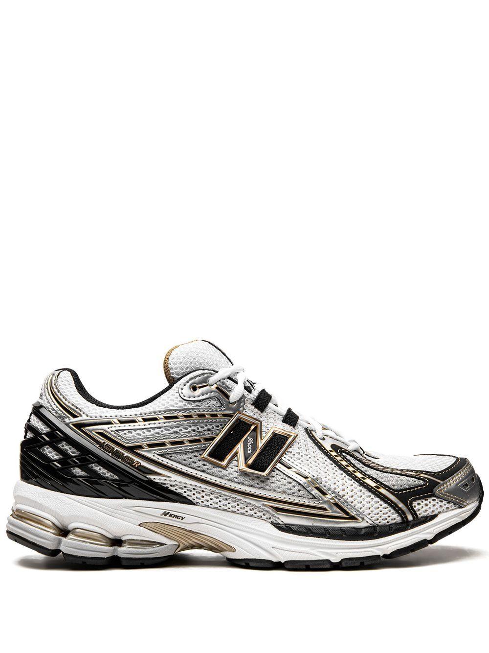 NEW BALANCE Sneakers U1906A bianche nere e oro 