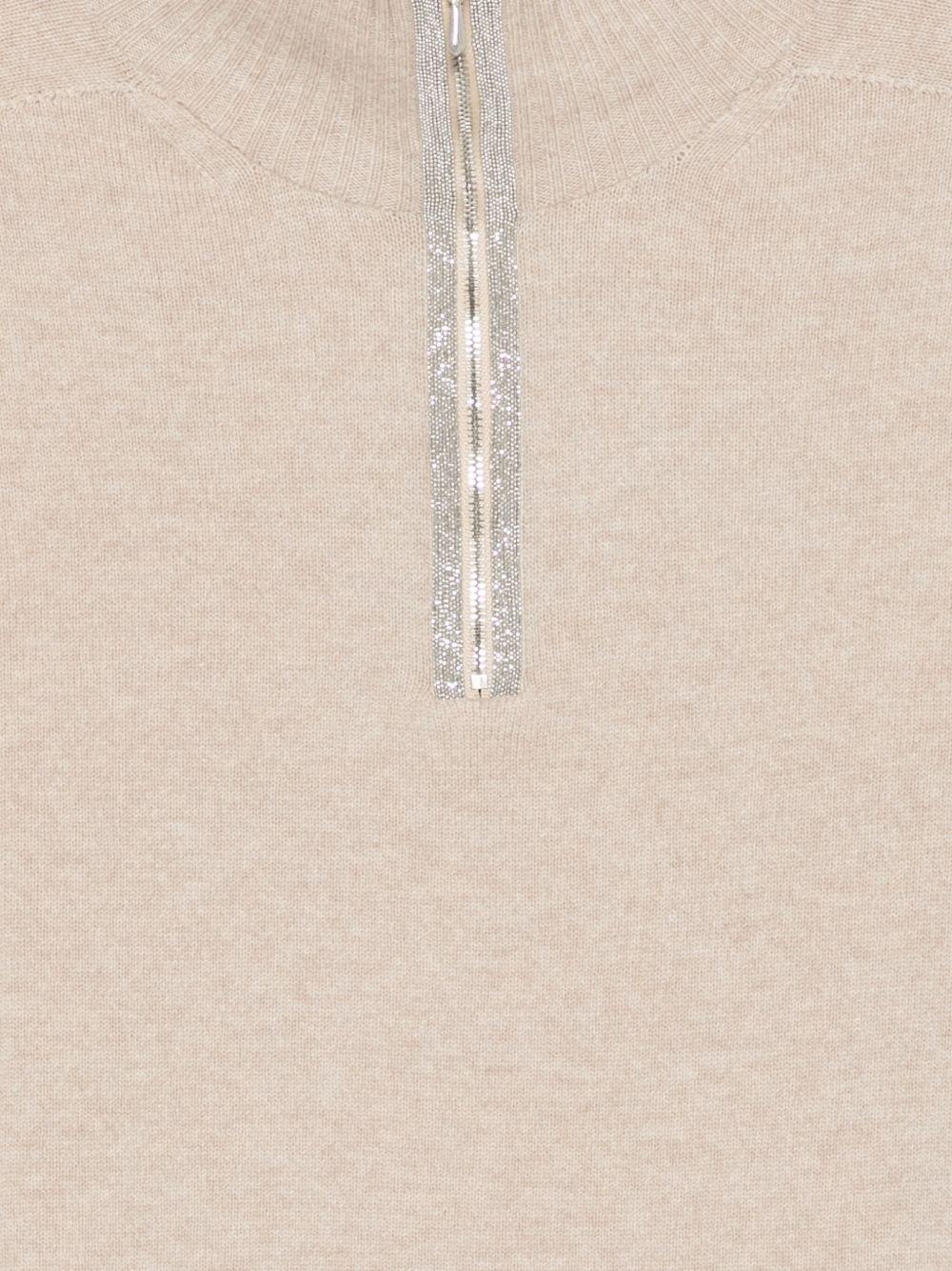 D EXTERIOR Maglia beige con collo alto e zip 