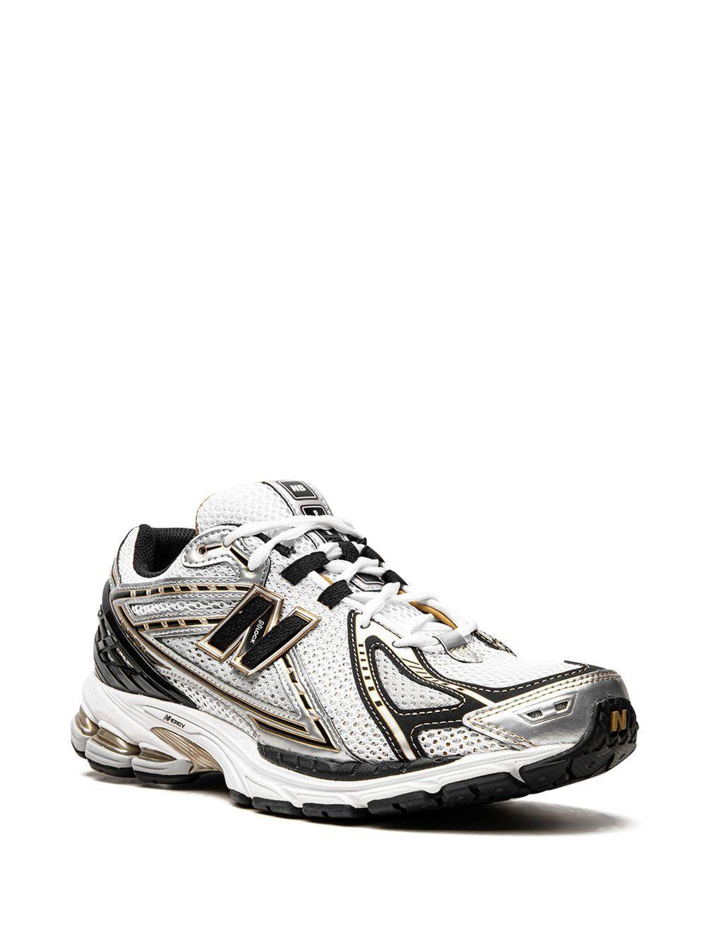 NEW BALANCE Sneakers U1906A bianche nere e oro 