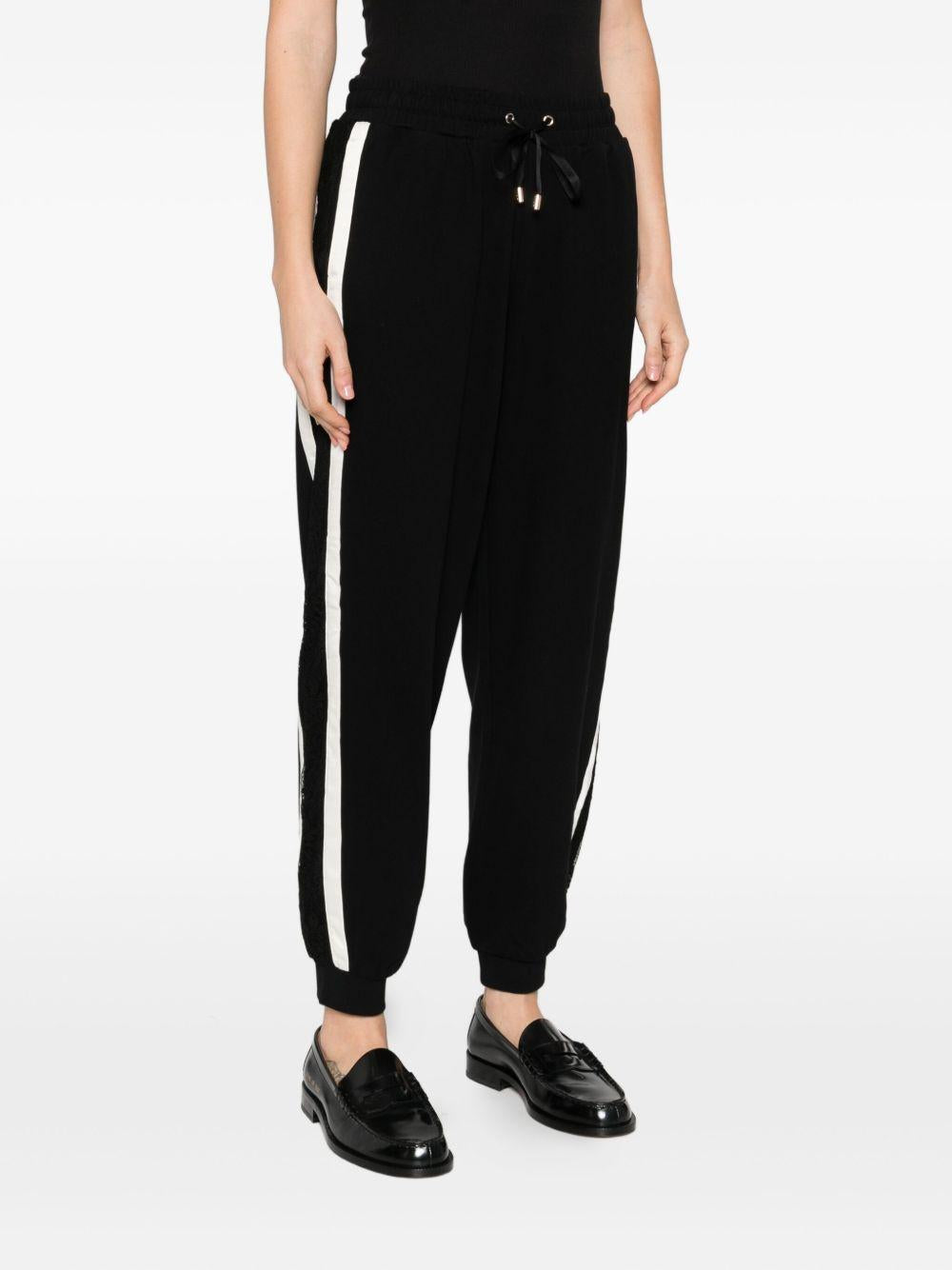 LIUJO Pantaloni neri sportivi bande laterali bianche 