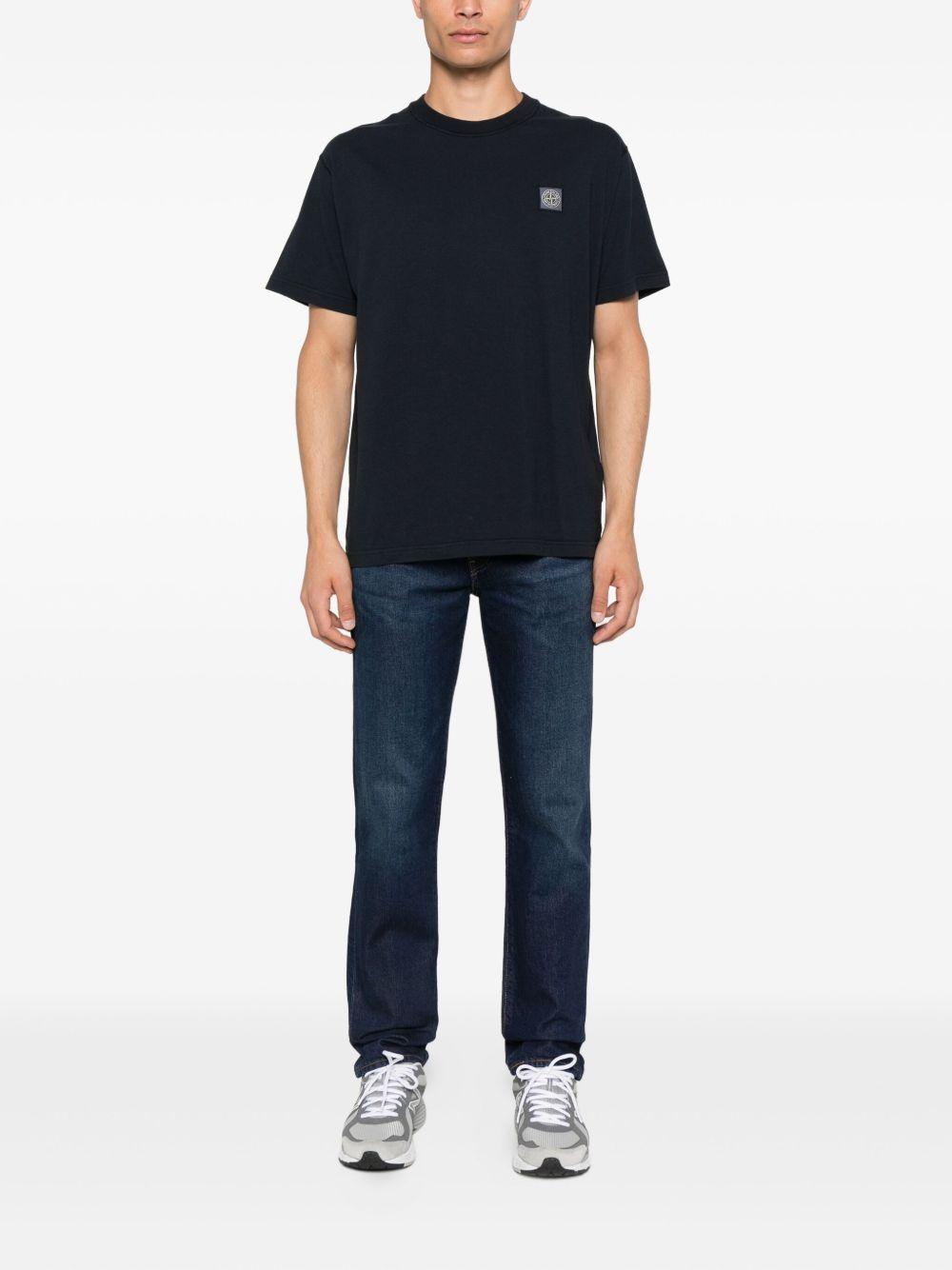 STONE ISLAND T-shirt nera in cotone biologico con applicazione logo Compas 