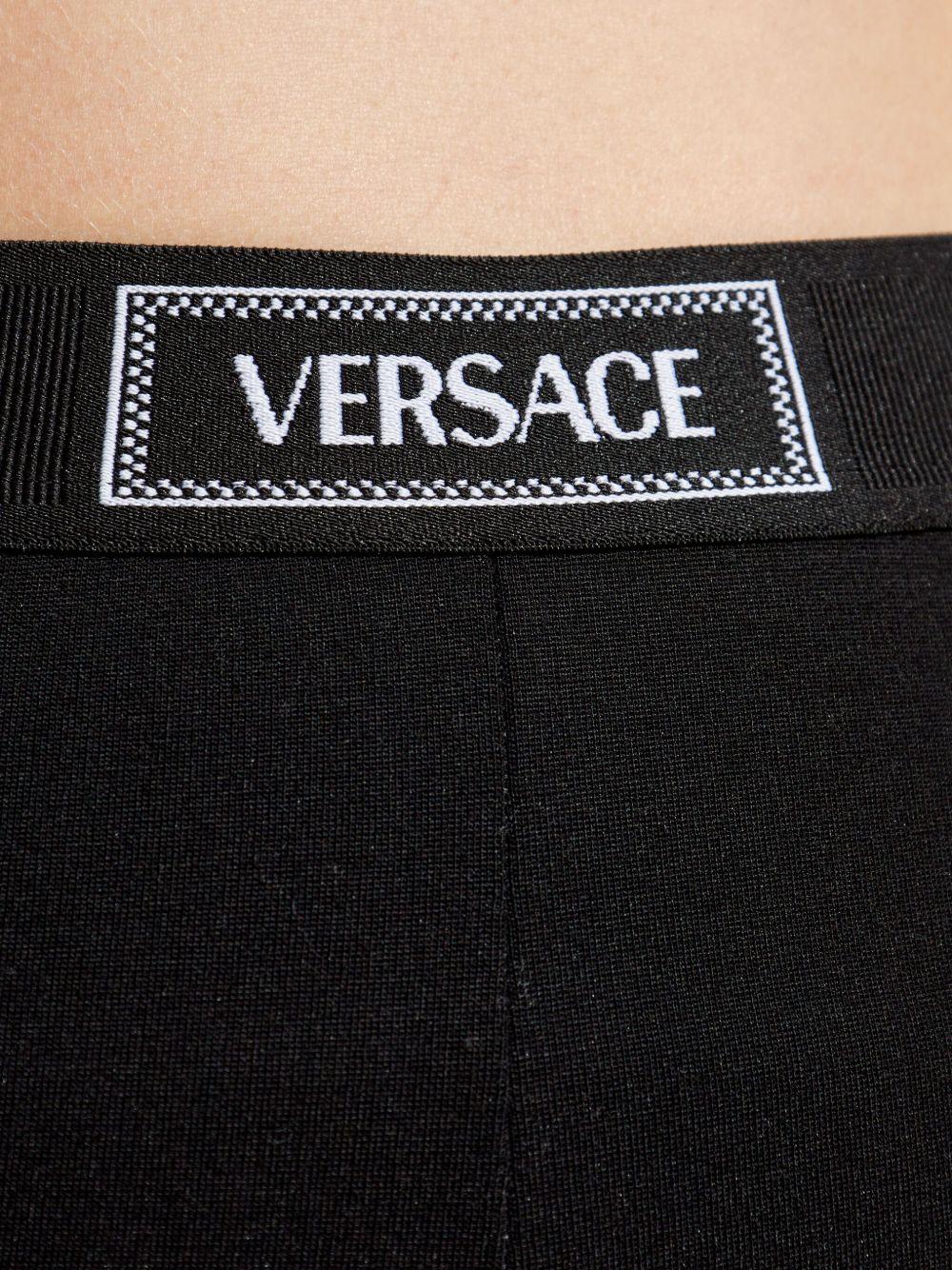VERSACE Leggings neri con elastico in vita con logo 