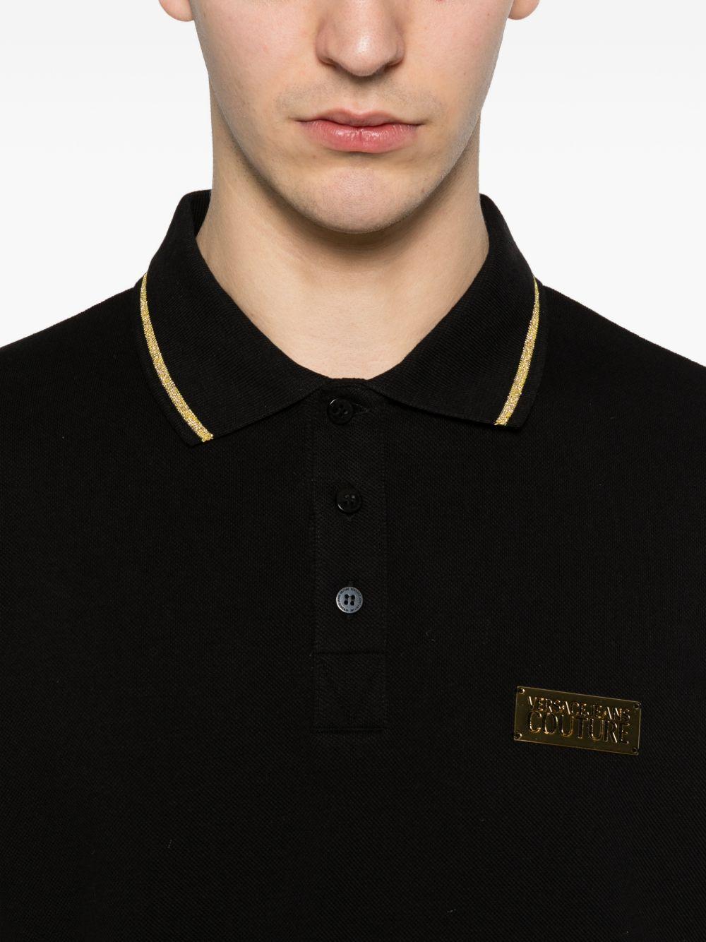 VERSACE JEANS COUTURE Polo nera con bordo a coste e logo 