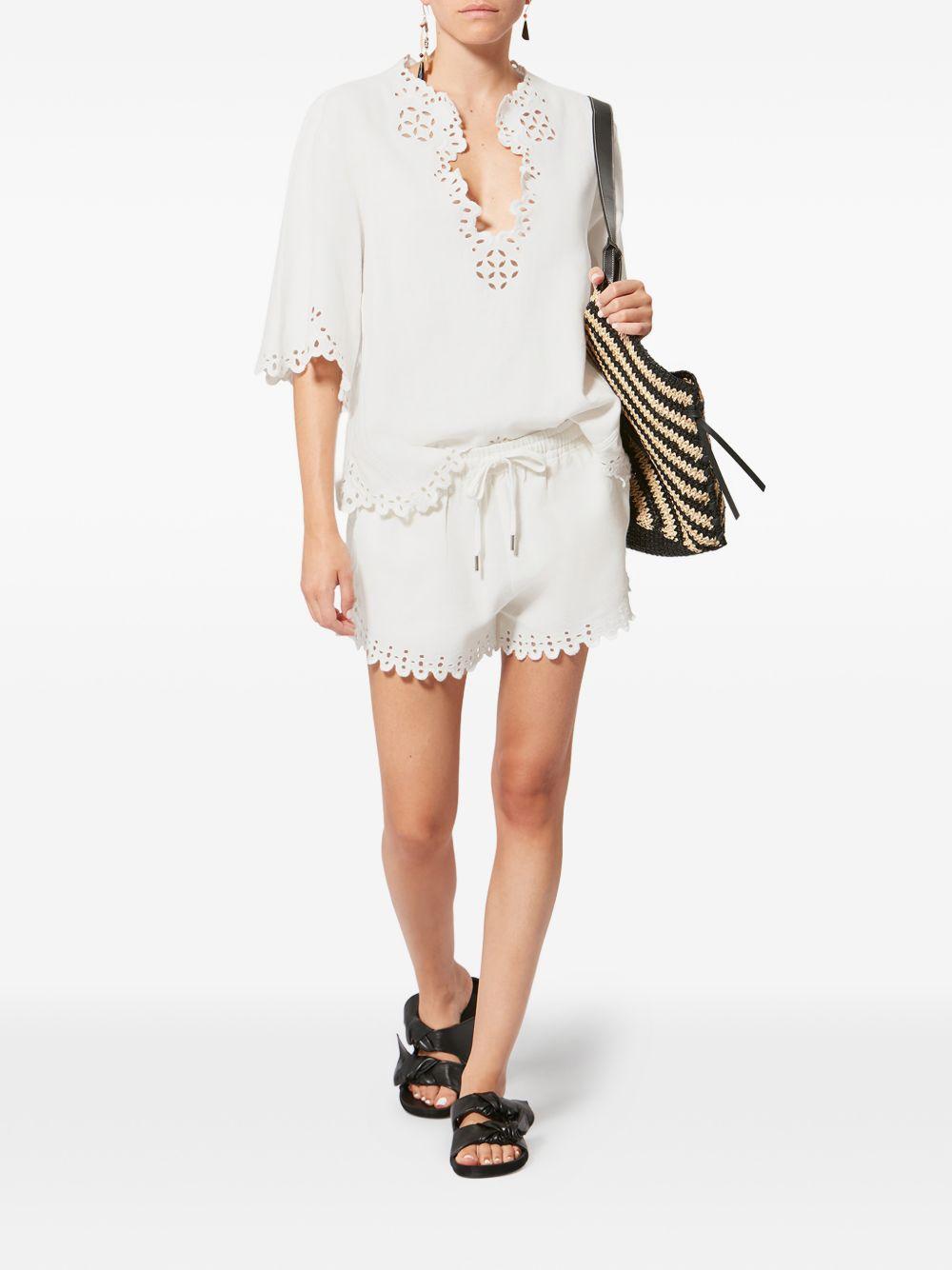 MARANT ETOILE Blusa bianca a maniche corte con scollo a V e orlo smerlato 