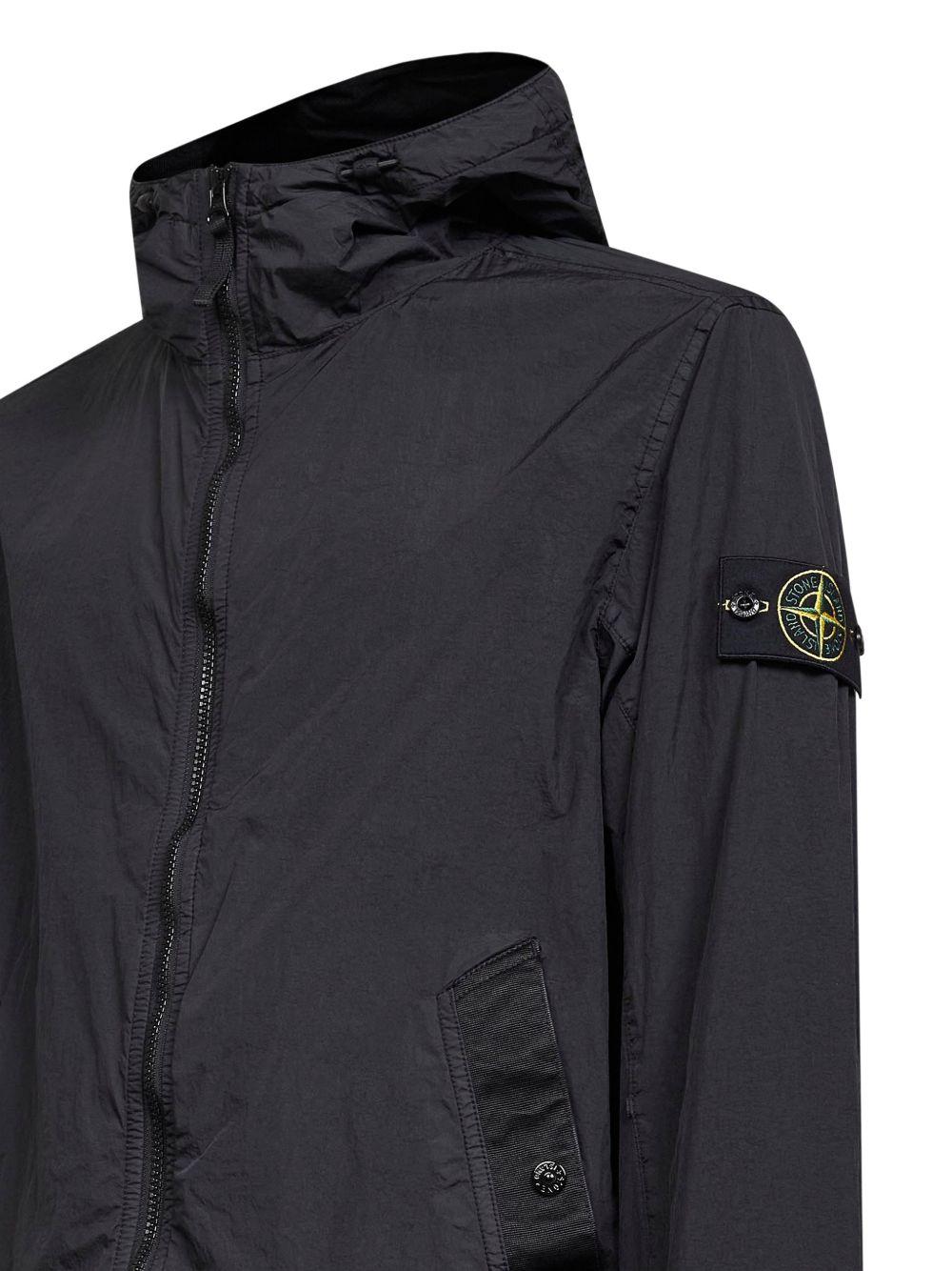 STONE ISLAND Giacca blu con tasche e patch logo 