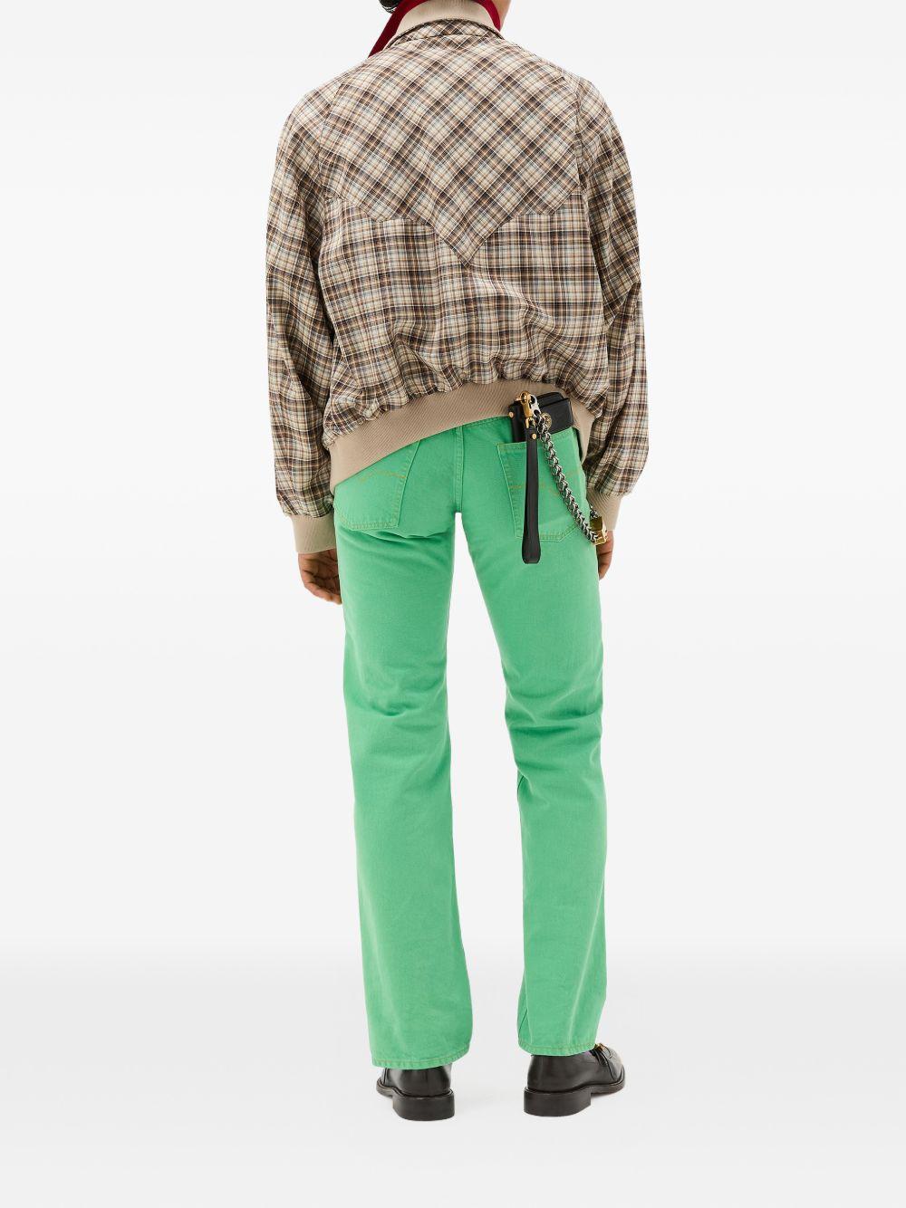 VERSACE Jeans lunghi verdi svasati 