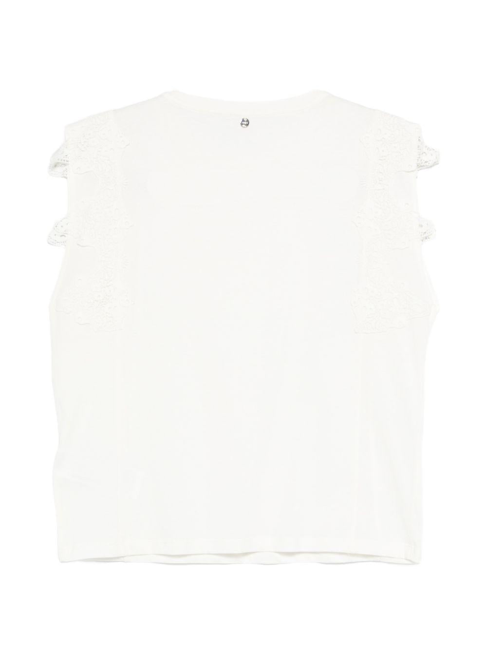 LIUJO T-shirt bianca con ricami e impreziosita da strass argentati 