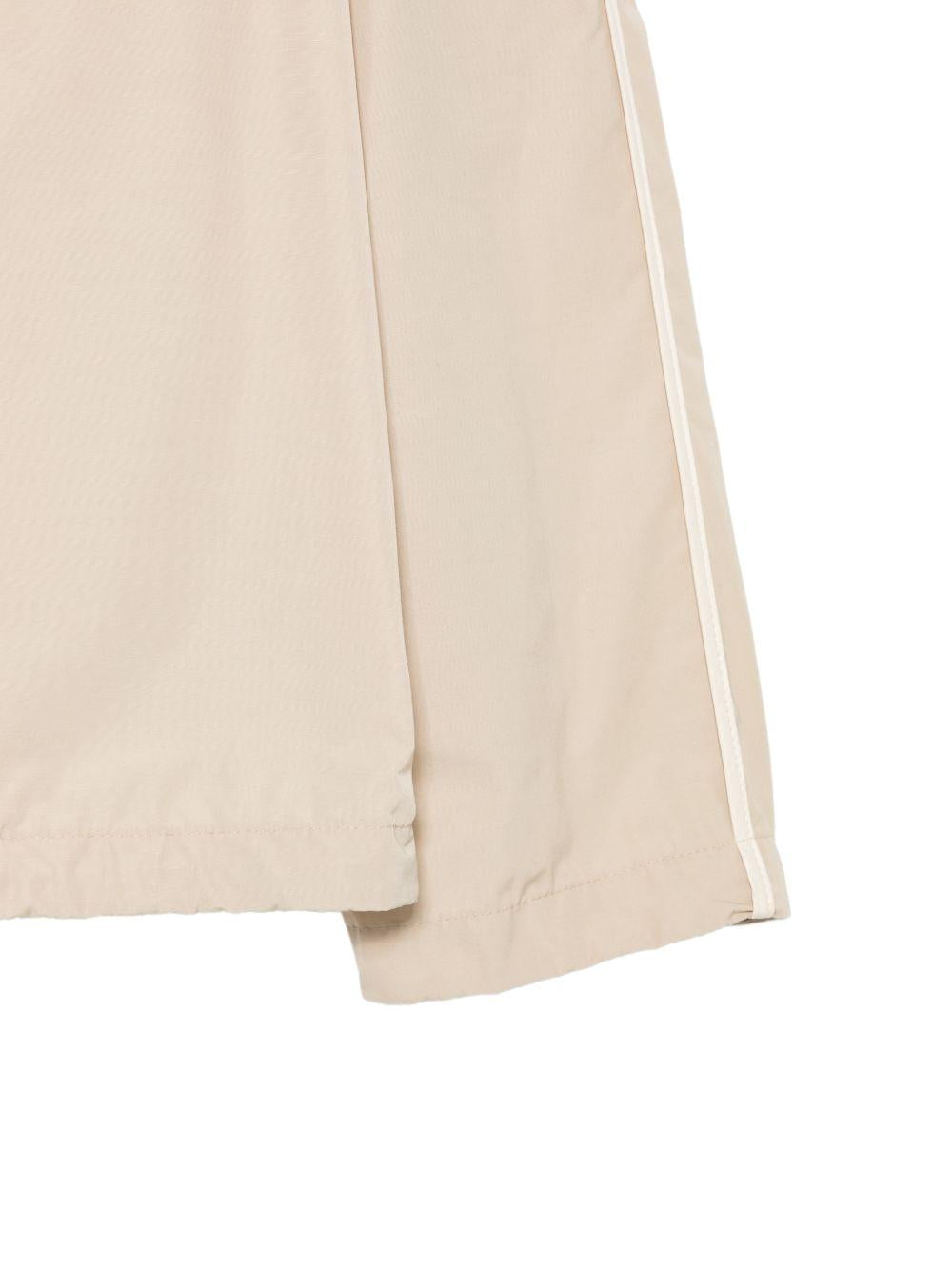 MONCLER Giubbotto beige tecnico con cappuccio e tasche 