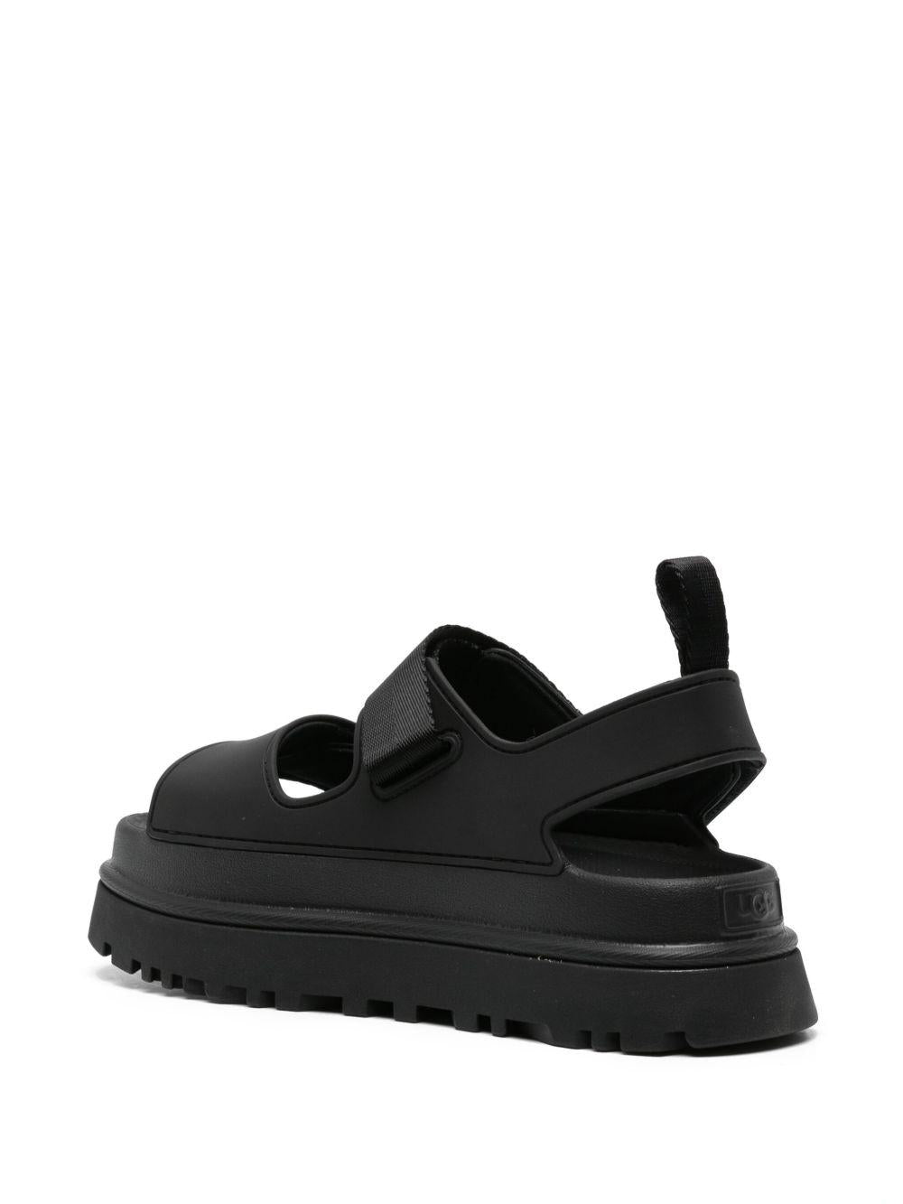 UGG Sandali neri con strappi e logo 