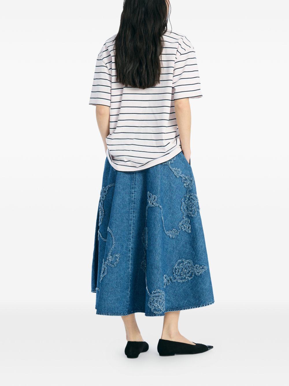 ROTATE Polo bianca a righe blu di cotone 