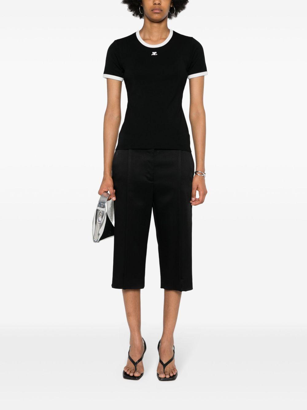 COURREGES T-shirt slim nera con rifiniture bianche 