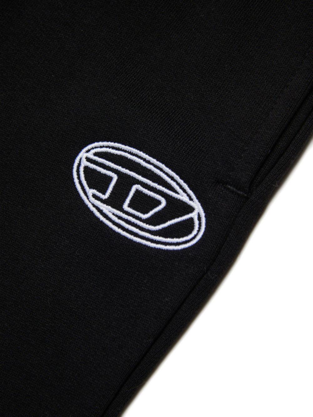 DIESEL Pantaloni svasati in cotone nero con logo 