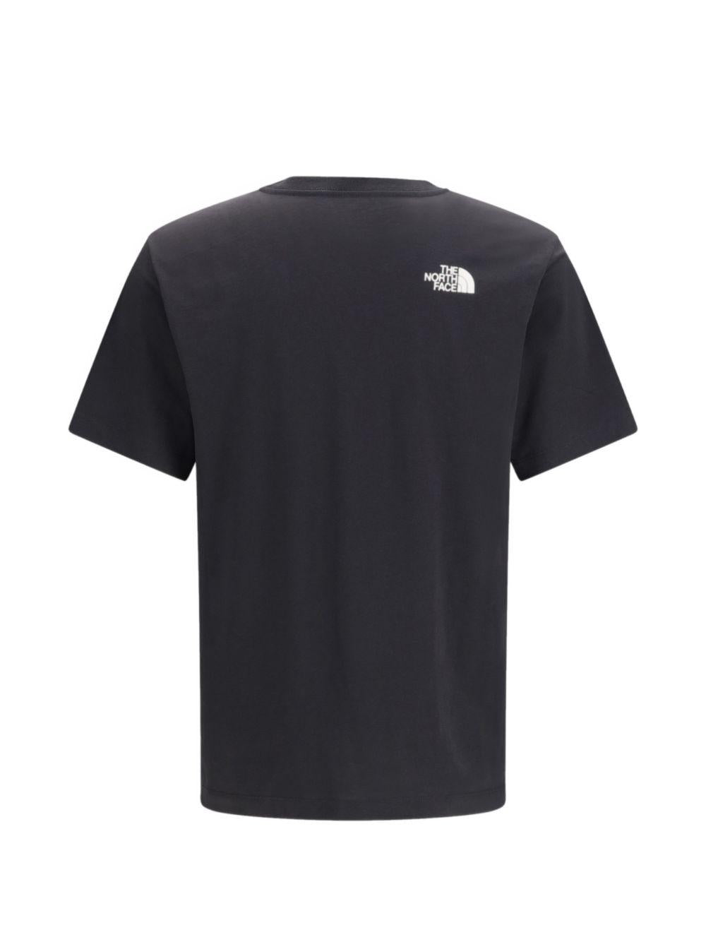 THE NORTH FACE T-shirt in cotone nero con patch logo 