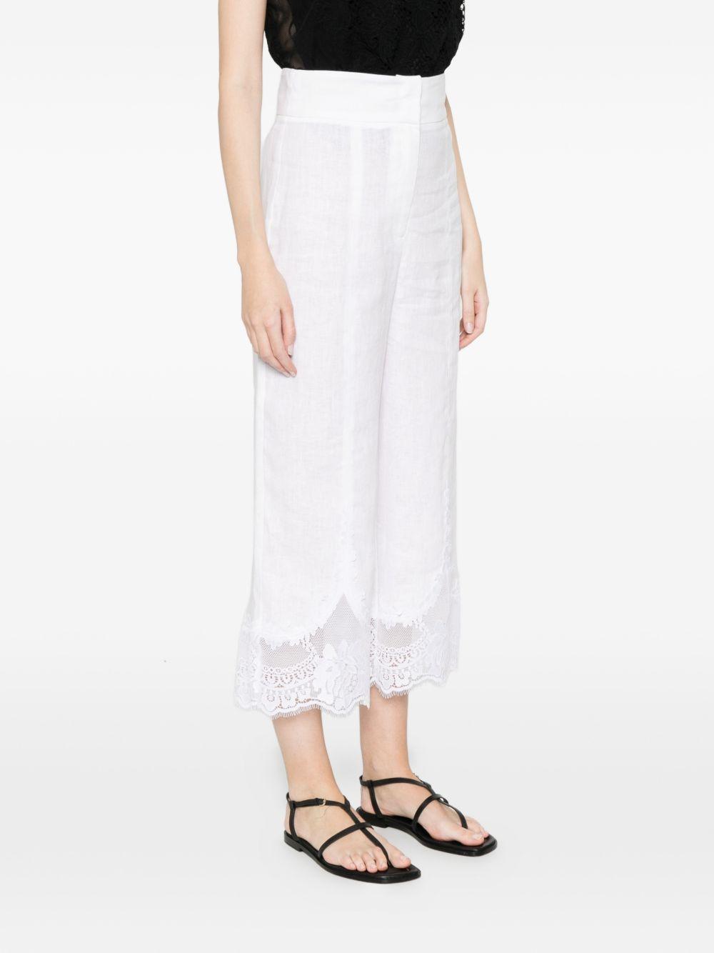 TWINSET Pantaloni bianchi di lino con pizzo sul fondo 