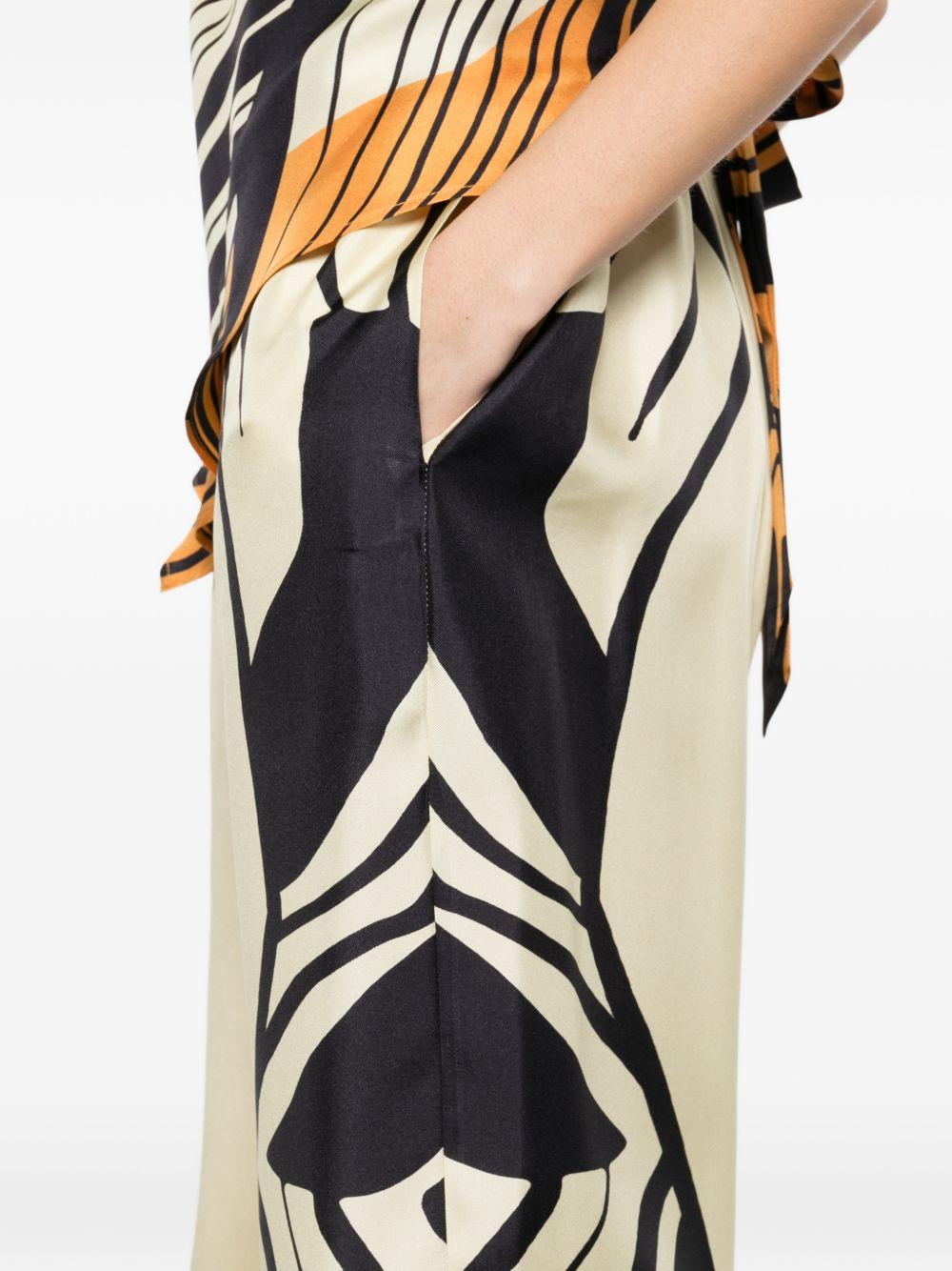 RAQUEL DINIZ Pantaloni con motivo astratto in seta avorio, nero, arancione 