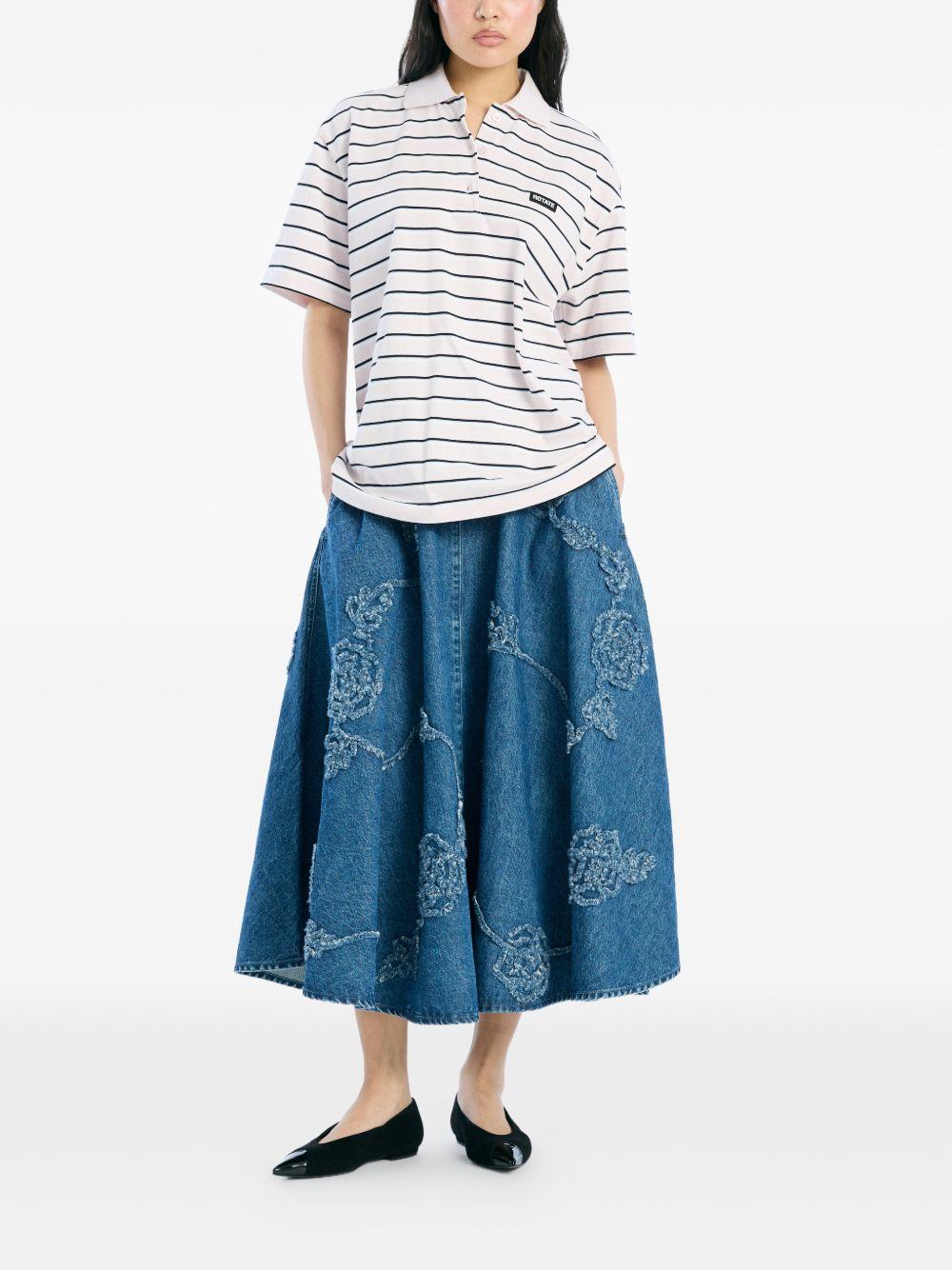 ROTATE Polo bianca a righe blu di cotone 