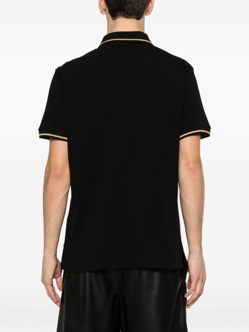 VERSACE JEANS COUTURE Polo nera con bordo a coste e logo 