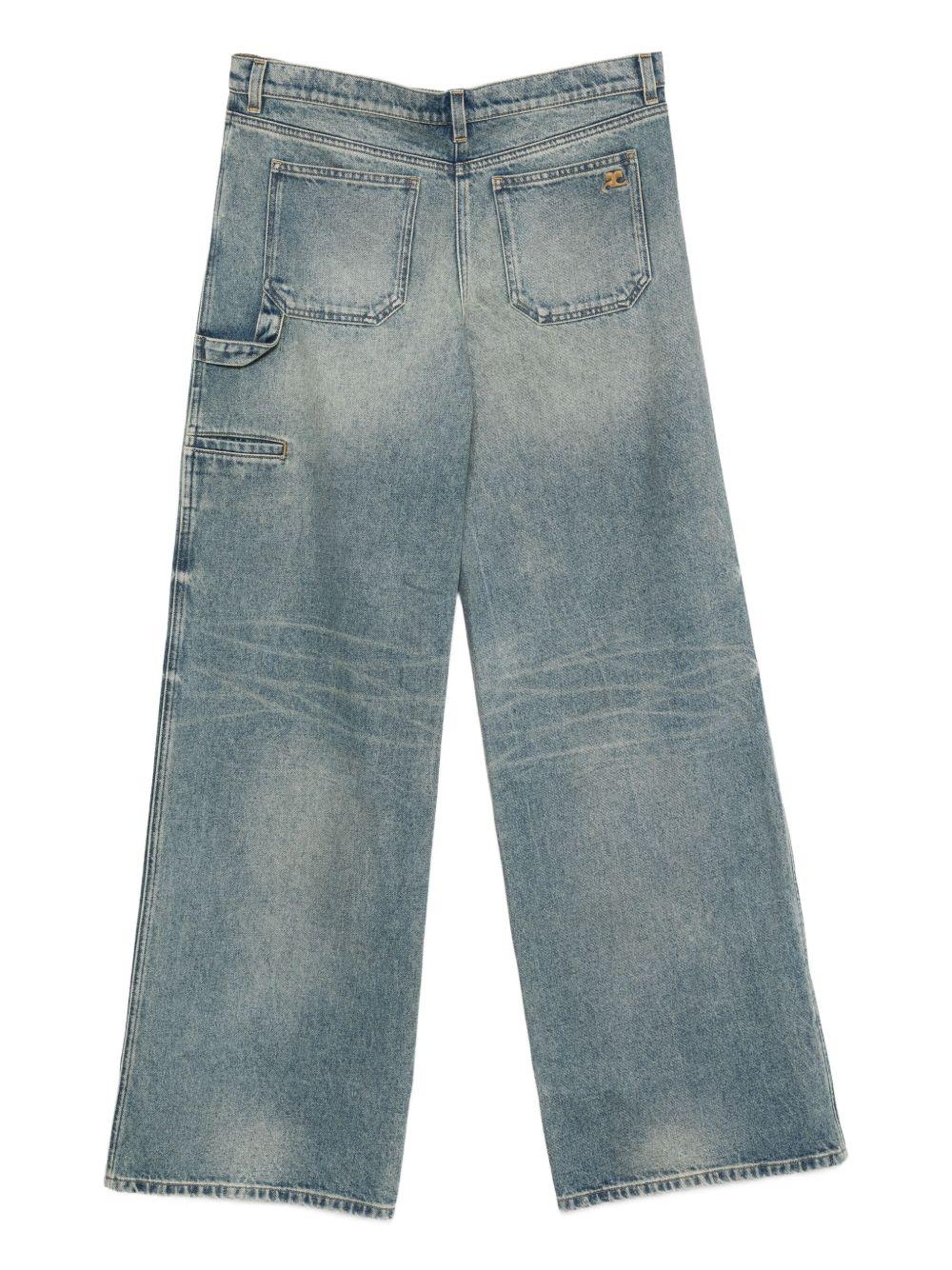 COURREGES Jeans blu con effetto washed sulla gamba 