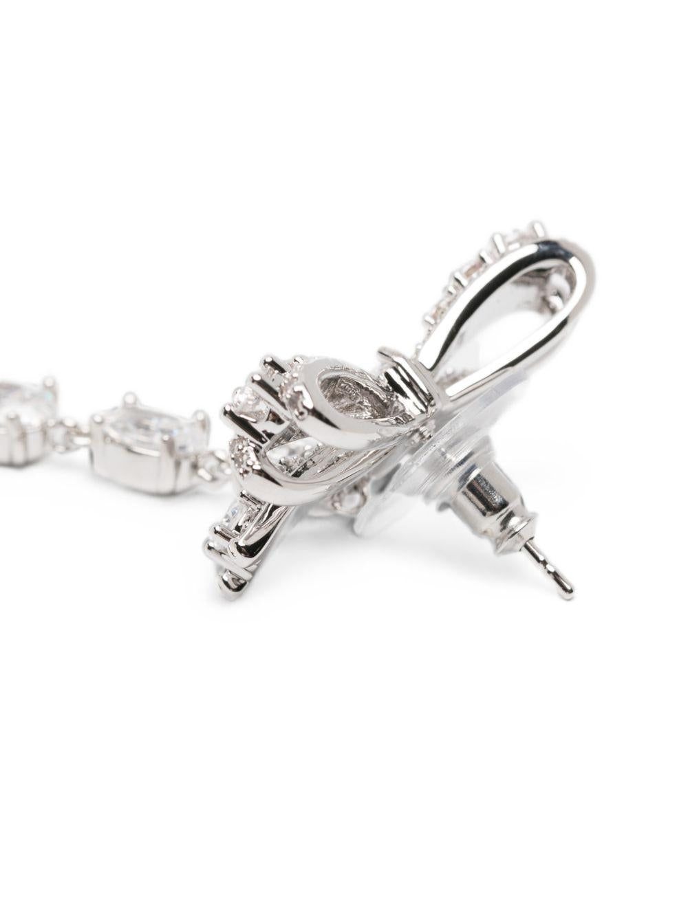 SELF PORTRAIT Orecchini a fiocco in ottone argentato con strass pendenti 