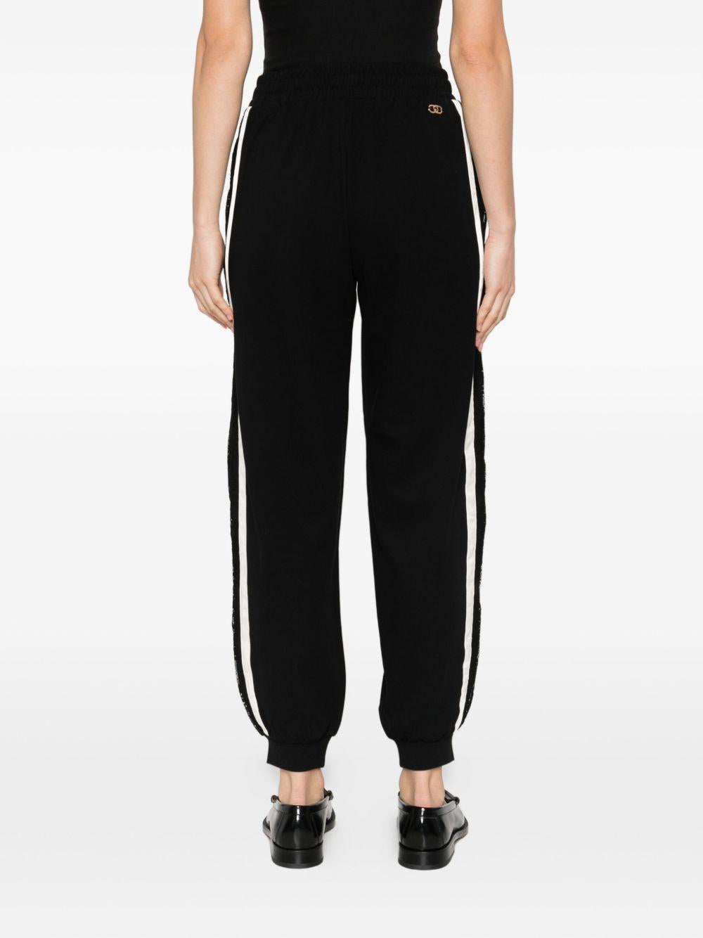 LIUJO Pantaloni neri sportivi bande laterali bianche 