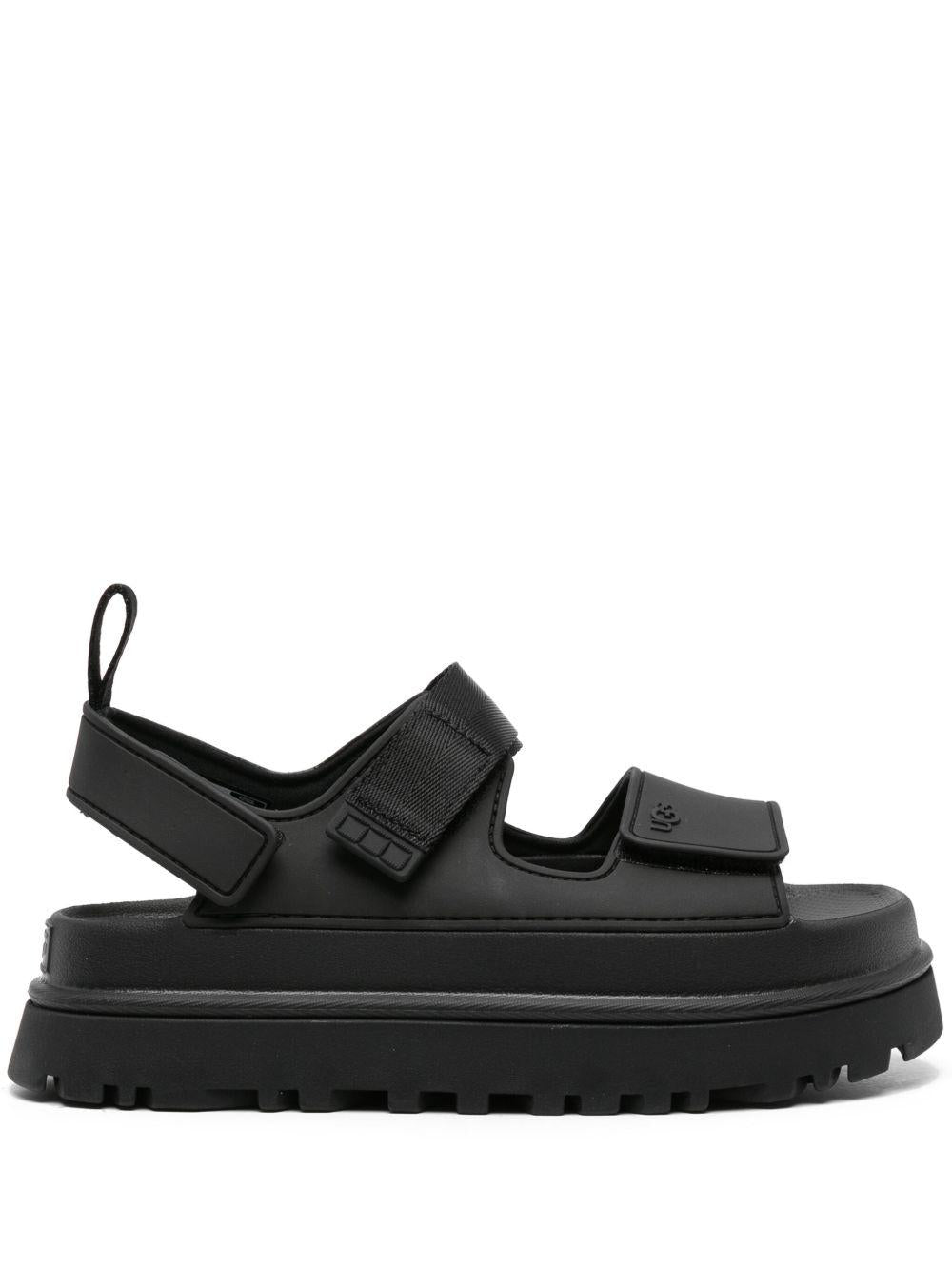 UGG Sandali neri con strappi e logo 