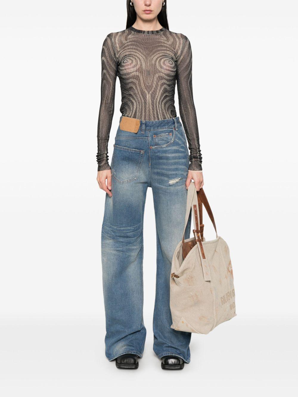 MM6 MAISON MARGIELA Jeans lunghi a gamba larga effetto wash 