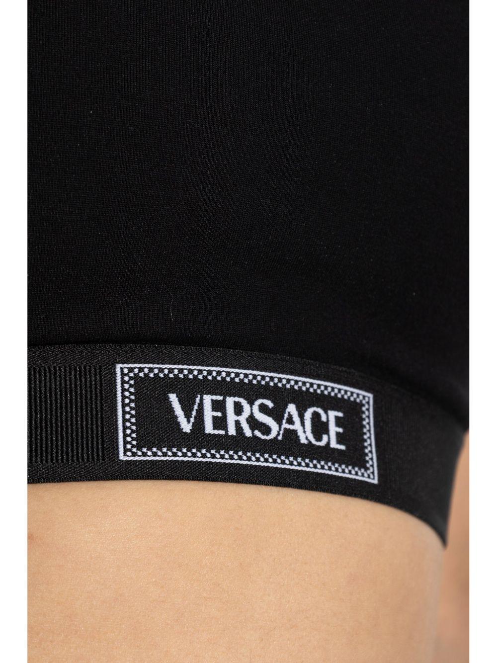 VERSACE Top nero con logo 