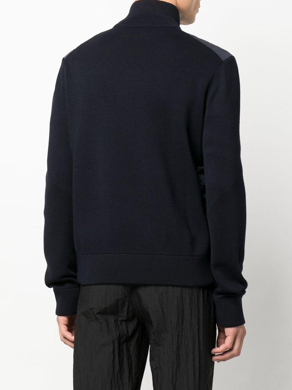 MONCLER Piumino blu navy con maniche di lana 