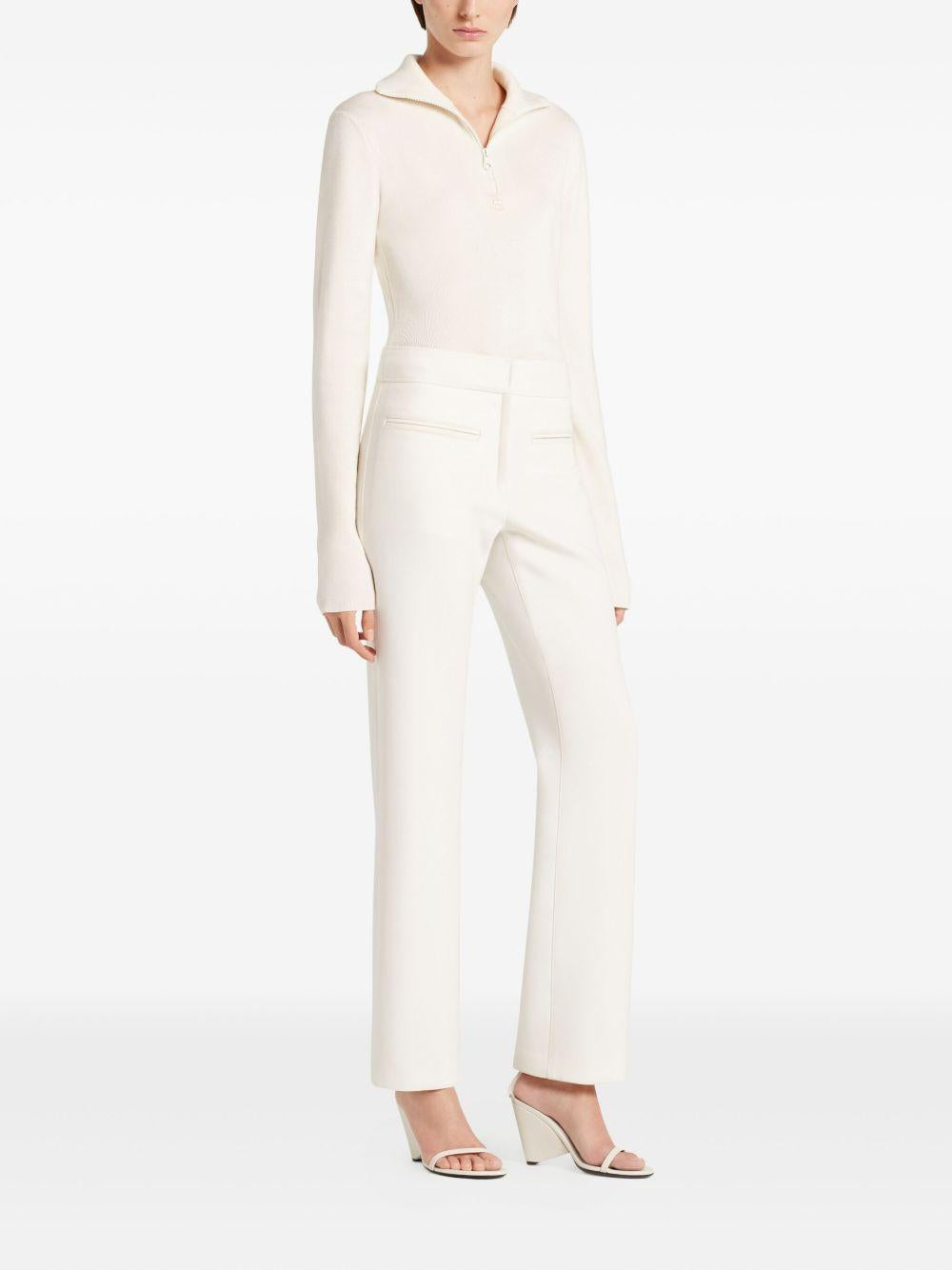 COURREGES Polo bianca con chiusura a zip sul collo 