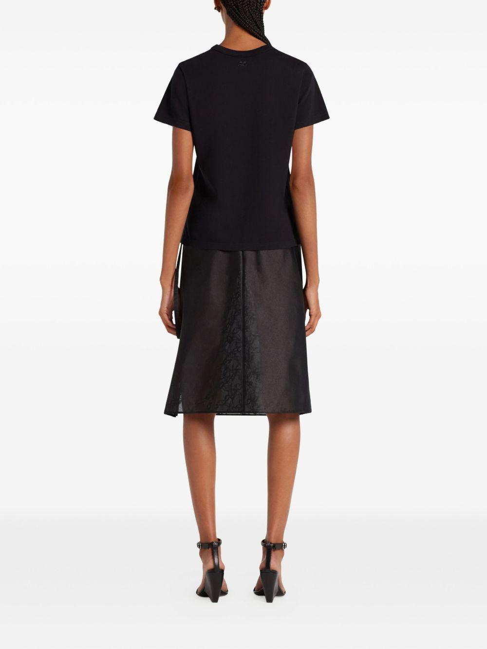 COURREGES T-shirt nera con logo sul petto 