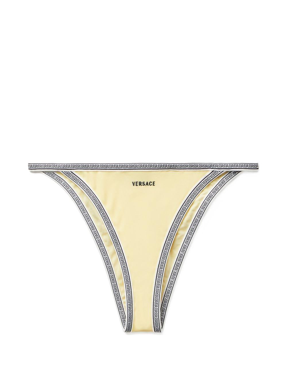 VERSACE Slip bikini giallo con bordo geometrico e logo 