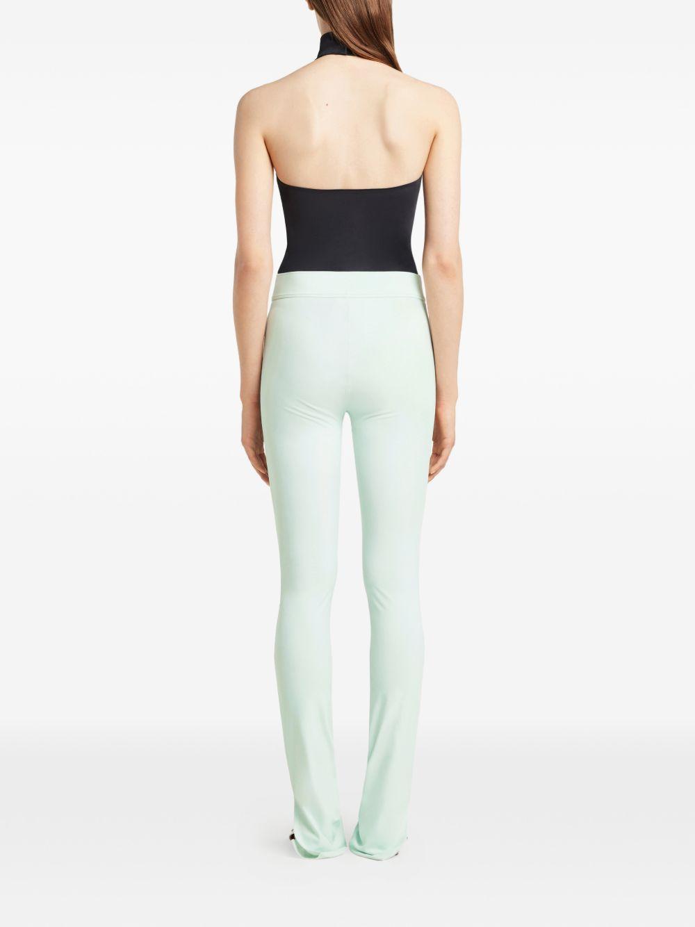COURREGES Body nero a collo alto con fibbia 