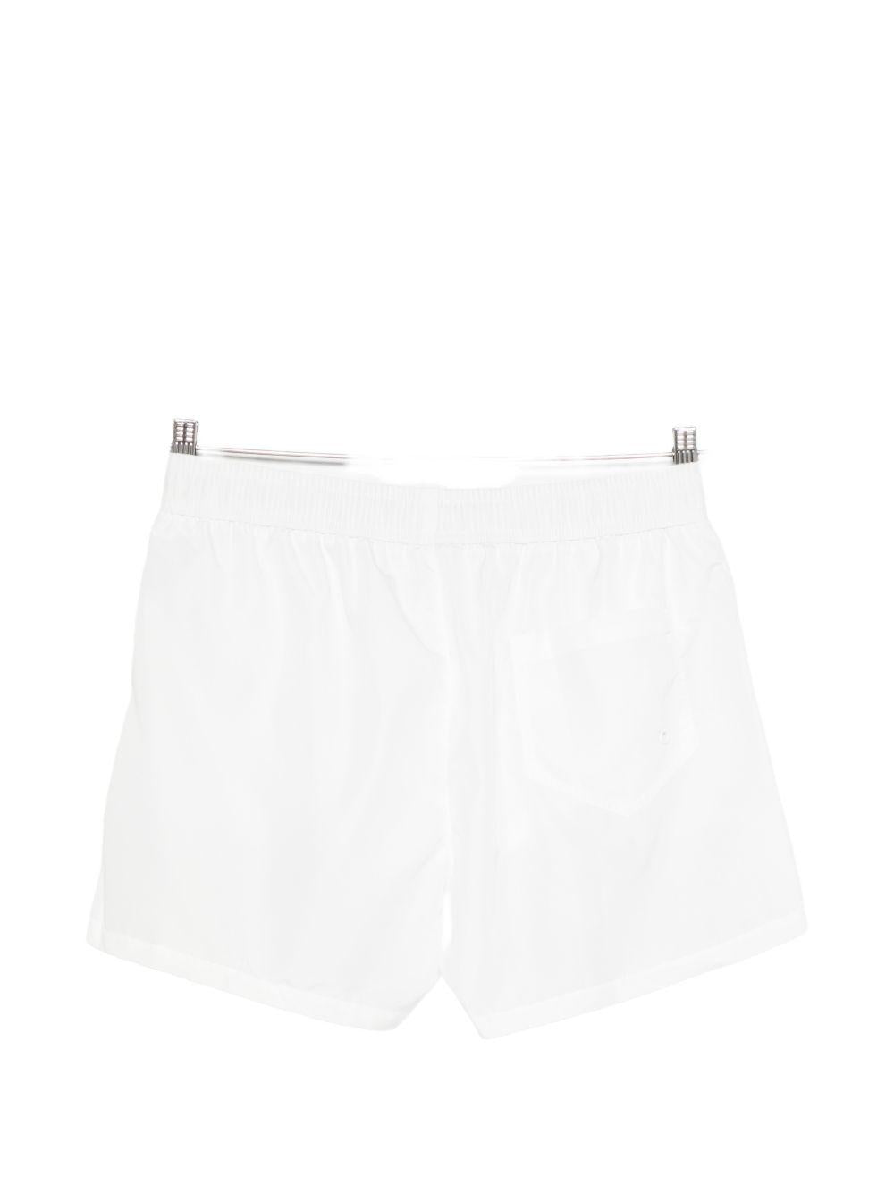 MOSCHINO SWIM Shorts da mare bianchi con coulisse in vita e logo all-over 