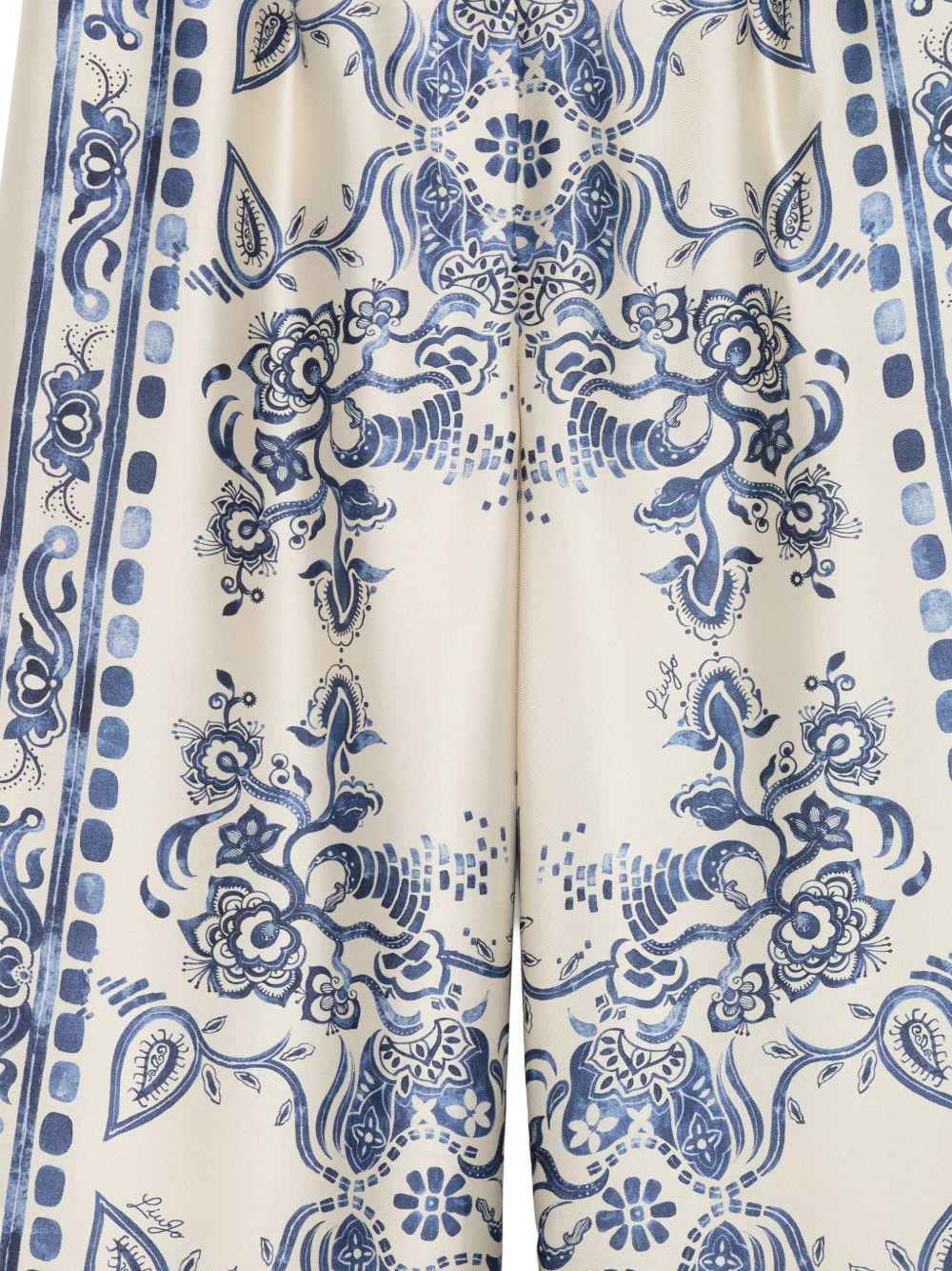 LIUJO Pantalone color crema con stampa floreale blu 