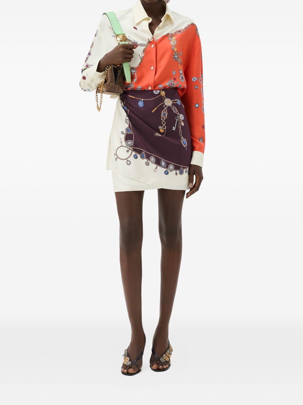 VERSACE Gonna in seta avorio e bordeaux con stampa multicolor 
