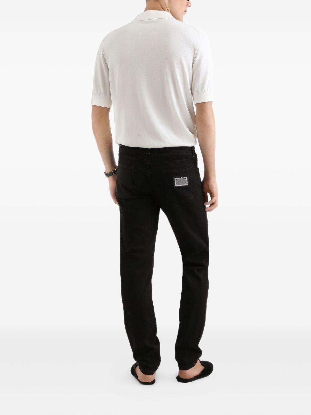 DOLCE e GABBANA Jeans nero con targhetta logo 