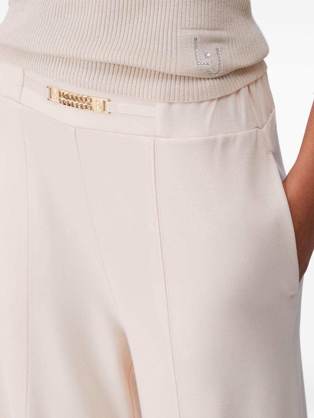 LIUJO Pantaloni cremai in jersey con dettaglio catena 