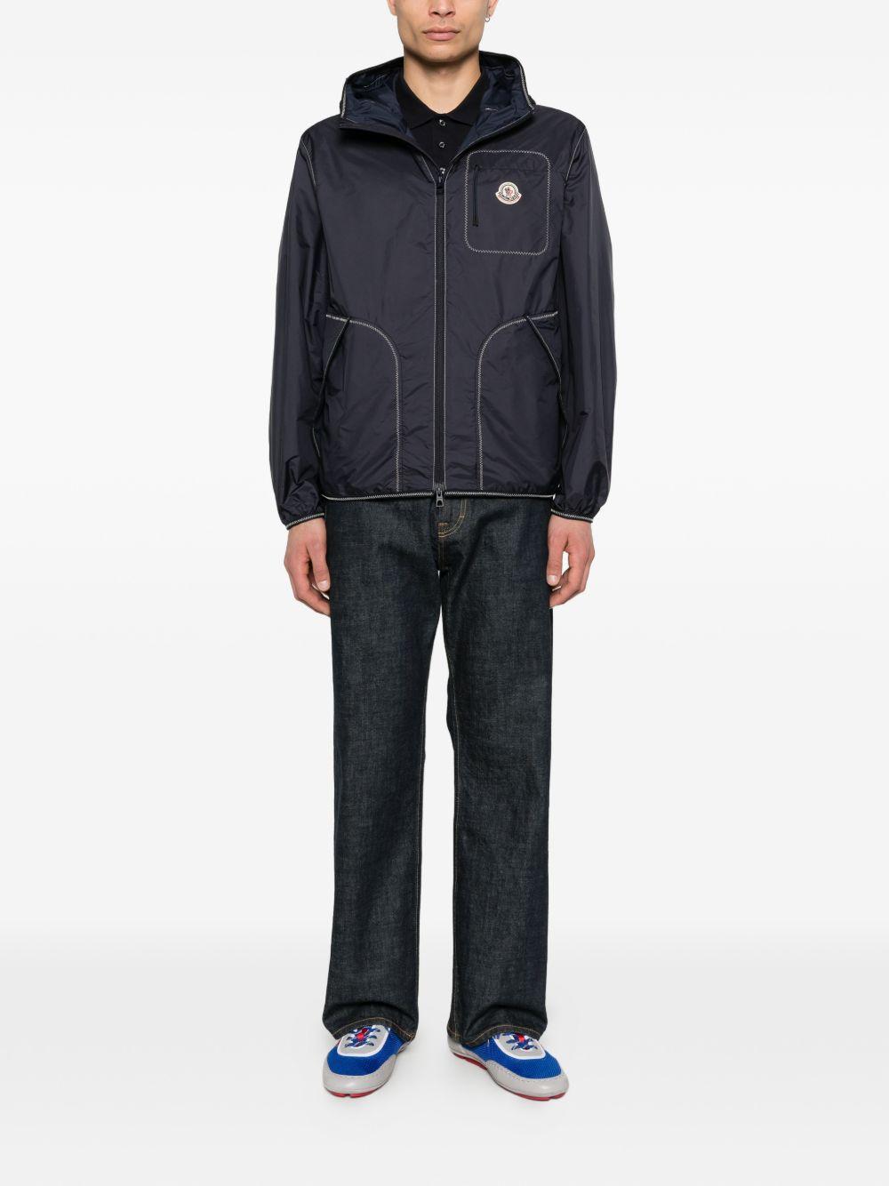 MONCLER Giacca a vento blu con cappuccio e zip 