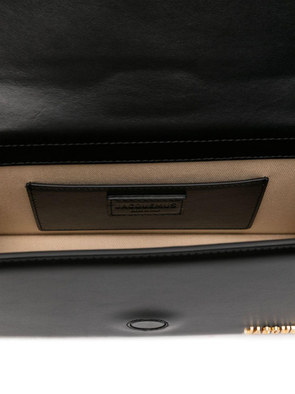 JACQUEMUS Borsa a spalla nera "Grande Bambino" con logo dorato 