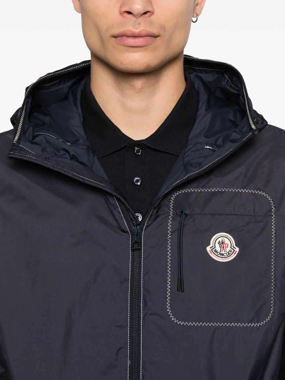 MONCLER Giacca a vento blu con cappuccio e zip 