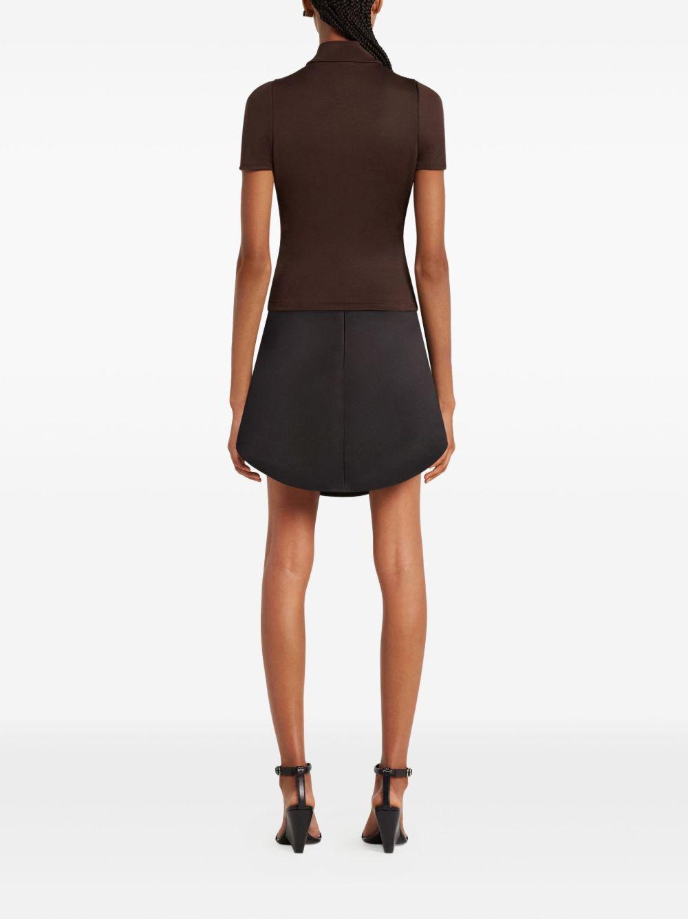 COURREGES Top nero con zip centrale e logo 