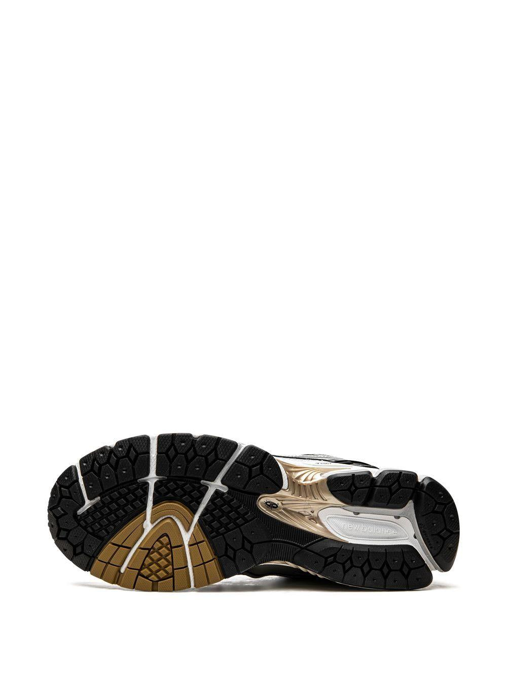 NEW BALANCE Sneakers U1906A bianche nere e oro 