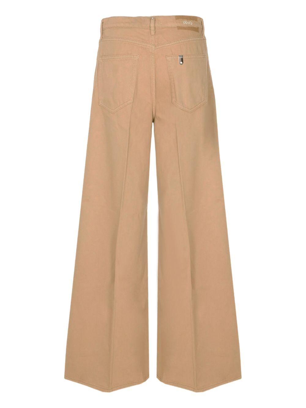 LIUJO Jeans color pesca con gamba svasata 