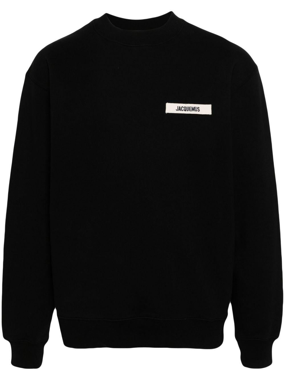 JACQUEMUS Felpa nera in cotone con patch logo sul petto 