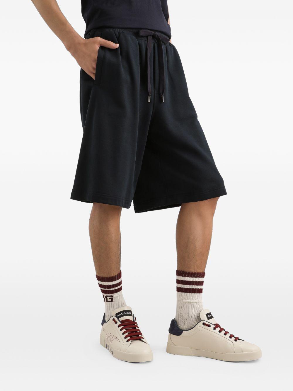 DOLCE e GABBANA Shorts in cotone nero con elastico e logo 