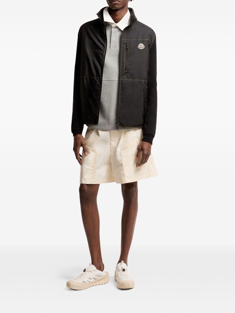 MONCLER Piumino cardigan Archivio blu con tasche e logo 